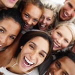 Closeup portrait of business colleagues holding each other and laughing