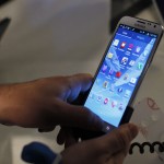 People use the Galaxy Note II after a news conference announcing Samsung’s update to its phone-tablet hybrid in New York